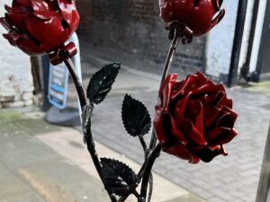 Handcrafted three stemmed metal rose